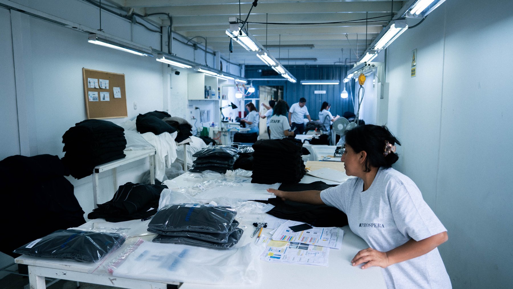Prospera staff folding and packing finished garments