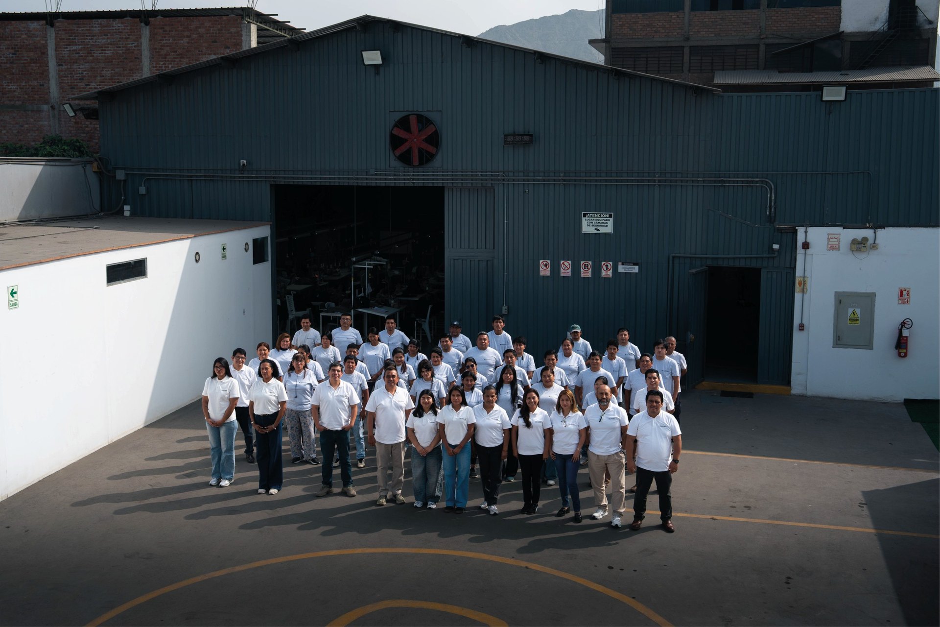 The Prospera Textil team gathered at the factory